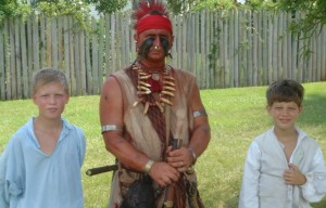 Indian and two boys at 225th anniversary reenactment of Camden battle